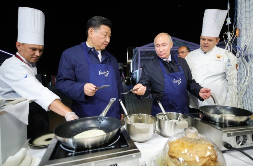Xi, Putin hail ties ahead of 'journey of peace' to Moscow