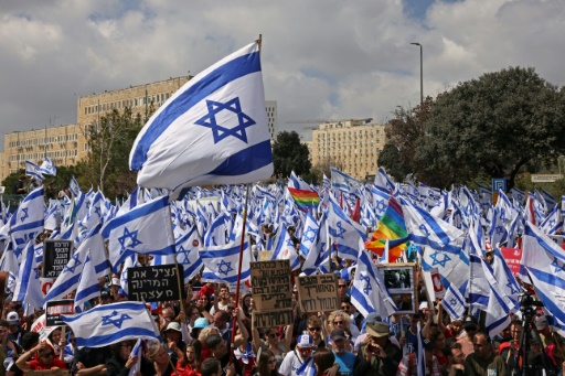 Israel's Netanyahu pauses judicial reform that split nation