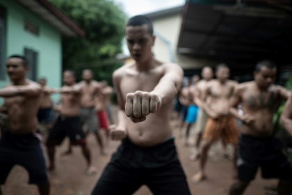 More than a hundred shaven-headed men take part in a day of weightlifting, karate drills, dancing and Buddhist prayer -- drug rehabilitation, Myanmar style