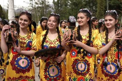 Tajik women in traditional attire celebrate the first day of spring in Dushanbe in March 2024. Authorities in the secular Muslim country are advising women to shun skimpy Western clothes as well as Islamic full-body coverings for national dress