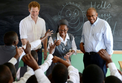 Britain's Prince Harry, flanked by Sister Victoria Mota, and Prince Seeiso, the younger brother of King Letsie of Lesotho visited projects supported by the Sentebale charity in 2013