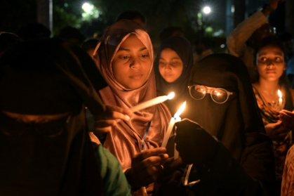 Indians have held vigils to mourn the 26 men killed in an attack in Kashmir