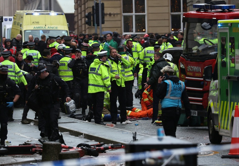 Football unites after car ploughs into Liverpool victory parade