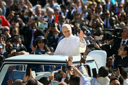 Pope Leo XIV made his debut tour in a popemobile, smiling, waving energetically and blessing the cheering crowds at the Vatican - Alberto PIZZOLI (AFP)