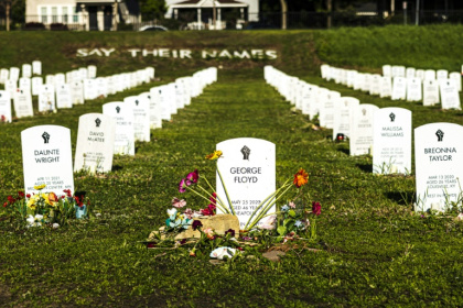 George Floyd is among model headstones bearing the names of people killed by law enforcement in the 'Say Their Names' cemetery in Minneapolis - Kerem YUCEL (AFP)