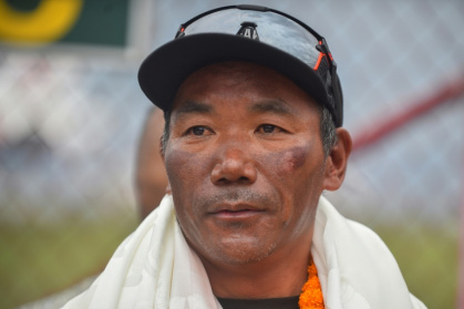 Nepali guide Kami Rita Sherpa reached the peak of the world's highest mountain for a record 31st time on Tuesday - NISHA BHANDARI (AFP)