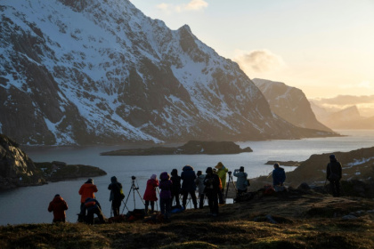 Tourists photograph a fjord in Norway's Lofoten Islands - Olivier MORIN (AFP)