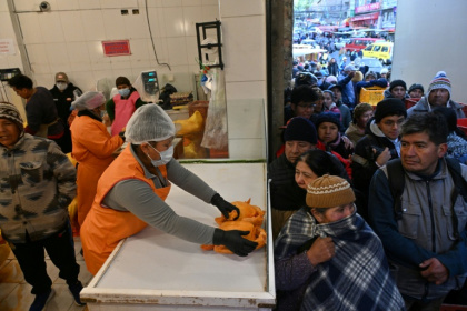 Long queues for staples, medicine and fuel have become commonplace in economically-battered Bolivia - AIZAR RALDES (AFP)