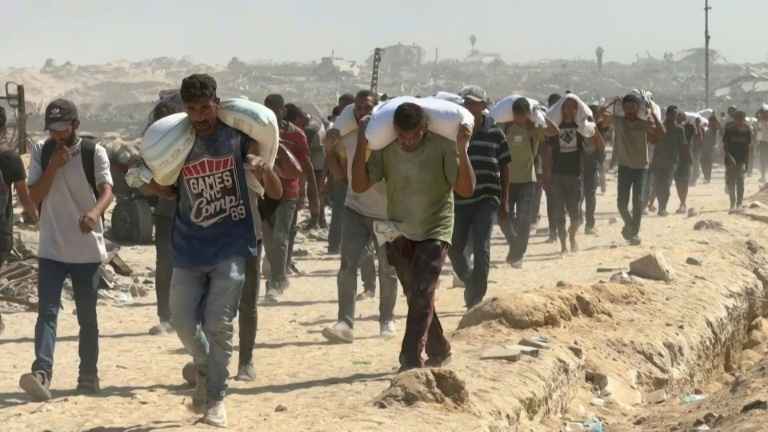 Food airdropped into Gaza as Israel says opening aid routes