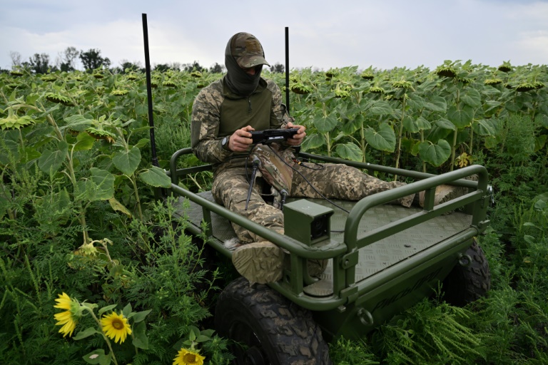 Under a drone canopy, Ukraine army medics rely on robots and luck