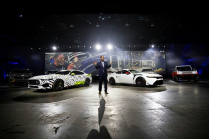 Ford Motor Company President and CEO Jim Farley stands between the Ford Mustang RTR (L) and the Ford Mustang GTD at the 2025 Detroit Auto Show - BILL PUGLIANO (AFP)