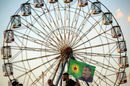 Abdullah Ocalan, pictured on the flag, founded the PKK in the late 1970s with the Kurdish militant group taking up arms against the Turkish state in 1984 - Delil SOULEIMAN (AFP)
