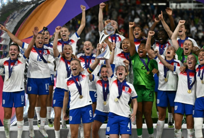 England players lift the trophy after beating Spain on penalties to win the Women's Euro 2025 - Fabrice COFFRINI (AFP)