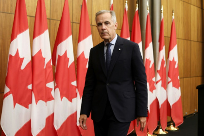 Canadian Prime Minister Mark Carney exits a press conference after announcing plans to recognize a Palestinian state - Dave Chan (AFP)