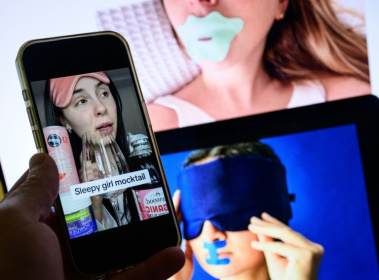 The trend of 'sleepmaxxing,' featuring mouth taping, eye masks and other bedroom practices with unproven health effects, is being promoted on social media by online influencers - Drew ANGERER (AFP)