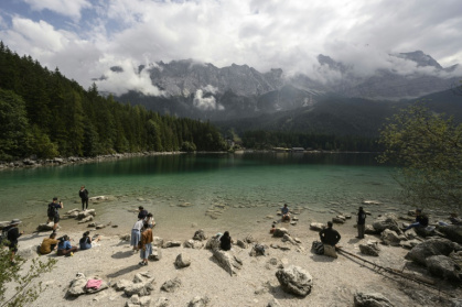 The crystalline waters and mountain vistas of Bavaria's Eibsee lake have racked up millions of views on social media, fuelling fears it will be loved to death by overtourism - Philipp Guelland (AFP)