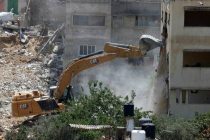 An Israeli military bulldozer demolishes a home at the Nur Shams Palestinian refugee camp in the Israeli occupied West Bank on June 23, 2025 - Jaafar ASHTIYEH (AFP)