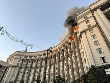 After Sunday's attack on Kyiv, flames could be seen rising from the roof of the sprawling government complex - Handout (AFP)
