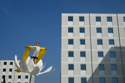 Artists perform in the Olympic and Paralympic Village of the 2026 Milano-Cortina Winter Olympics on the day of its official presentation - Stefano RELLANDINI (AFP)