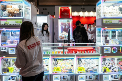 Claw machines have been around since before World War II, but have gone through some radical transformation since - Philip FONG (AFP)