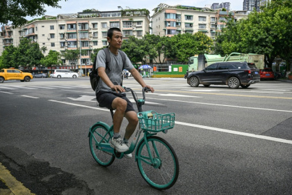 Author Hu Anyan was one of the millions of delivery drivers powering China's retail giants - Jade GAO (AFP)