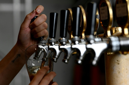 Inspectors say many Australian beer drinkers are getting less than they pay for at the bar - Saeed KHAN (AFP)