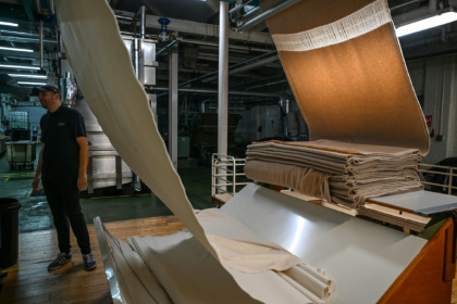 Rolls of cashmere are processed at the Alex Begg mill in Ayr, Scotland, far from the catwalks of Paris, Milan and London - Andy BUCHANAN (AFP)