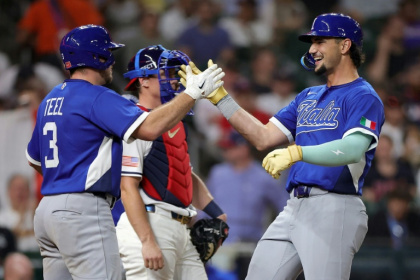 Kyle Teel (left) congratulates teammate Jac Caglianone after his solo home run in Italy's 8-6 upset over the United States - Alex Slitz (AFP)
