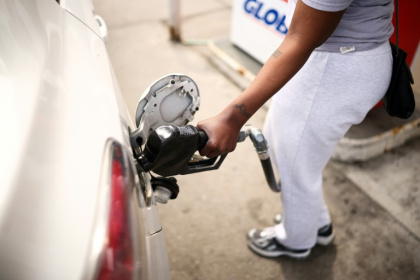 Analysts say high fuel prices do not just hit household budgets, they also reduce overall household consumption - CHARLY TRIBALLEAU (AFP)