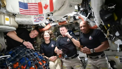 This screengrab from a NASA livestream shows Artemis II crew members Jeremy Hansen, Christina Koch, Reid Wiseman and Victor Glover speaking with US President Donald Trump via a call aboard the Orion spacecraft on April 6, 2026 - Handout (AFP)
