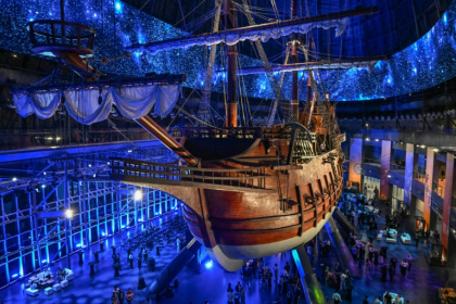 Visitors under the Galeon Espiritu Santo, a full-scale representation of a 17th century galleon, on display at the Museo del Galeon in Manila - Jam STA ROSA (AFP)