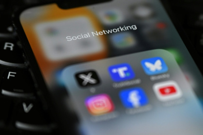 Britain's plans reportedly aim to totally ban social media for under 16s, and stop late-night scrolling by older teenagers - Justin TALLIS (AFP)